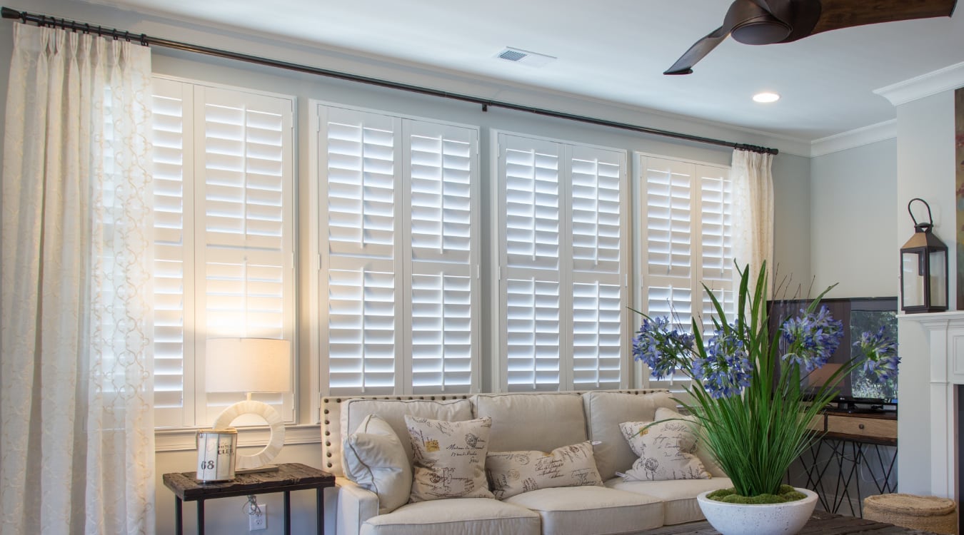 Plantation shutters with curtains 